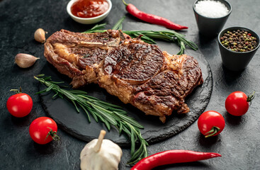 grilled cowboy beef steak on stone background