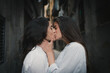 © Nuria Seguí/Stocksy - Lesbian couple kissing