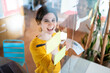 © Santi Nuñez/Stocksy - Businesswoman Putting Post-It Notes On Glass Board