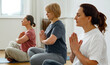 © Danil Nevsky/Stocksy - Group of women meditating in studio during yoga lesson