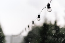 Garland Of Light Bulbs In The Rain