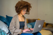 © Luis Velasco/Stocksy - Young Woman Working From Home With Laptop.
