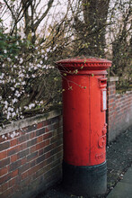 A Post Box Surrounded By Blossom