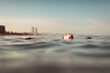 © Ibai Acevedo/Stocksy - Woman having a moment of relax in the sea