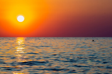 Wall Mural - Amazing sea sunset, the sun, waves, clouds