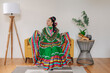 © ByLorena/Stocksy - Portrait girl dressed up with a traditional Mexican dress and braid hairstyle