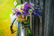 © Aleksandra - bouquet of wild flowers in a basket and on a bicycle