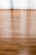 Vertical blinds cast shadows on a newly installed Brazilian Cherry hardwood floor