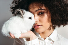 Beautiful Young African American Woman With A Rabbit.
