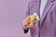 Woman In Violet Outfit Holding Burger With Roses