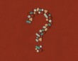 © Valeriya Simantovskaya/Stocksy - Many multi-colored medicines and pills in the form of a question mark