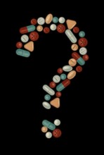 Many Multi-colored Medicines And Pills In The Form Of A Question Mark