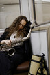 © Irina Ozhigova/Stocksy - Saxophonist in a subway
