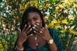 © Lucas Ottone/Stocksy - Happy black woman with cool manicure