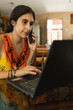 © Luis Herrera/Stocksy - woman working at home