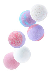 Wall Mural - Many different aromatic bath bombs falling on white background