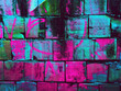 © Wizemark/Stocksy - Dark concrete blocks with vibrant colors background / texture