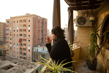 Smoke Break On Cairo Balcony