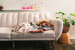 © ByLorena/Stocksy - Sofa and blankets in living room corner