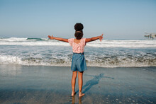 Girl At Beach With Outstretched Arms 