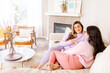 © ByLorena/Stocksy - Mother and teen daughter at home
