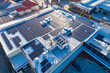 © Neal Pritchard/Stocksy - Aerial views over commercial building with over 600 solar panels installed