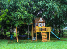 Backyard Wooden Swing Set For Kids To Play. Summer Time Activity
