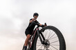 © Manu Prats/Stocksy - Sporty confident woman riding gravel bike in nature