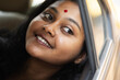 © Dream Lover/Stocksy - Young Indian woman inside car
