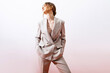 © Sergey Filimonov/Stocksy - Fashionable modern woman in suit