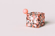 © Giada Canu/Stocksy - abstract futuristic cube with a pink ball