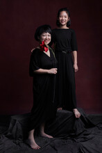 Portrait Of Asian Mother And Daughter , Wearing Black Skirt Indoors.