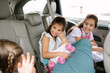 © Erin Drago/Stocksy - Sisters Sitting In The Backseat Of A Car