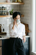 © Leah Flores/Stocksy - Woman Sipping Coffee