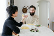 © Leah Flores/Stocksy - A Happy Couple Shares Dinner