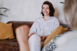© Alina Hvostikova/Stocksy - Cheerful woman speaking with psychologist