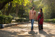 © Dream Lover/Stocksy - young Indian couple walking in a park
