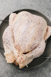 © Cameron Whitman/Stocksy - Seasoned whole young chicken