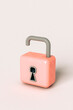 © Giada Canu/Stocksy - one open Pink padlock on grey background