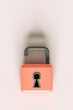 © Giada Canu/Stocksy - bird eye view of Pink padlocks on grey background
