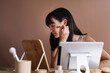 © Alberto Bogo/Stocksy - Young Asian Woman Applying Blush On Her Face