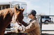 © Leah Flores/Stocksy - Happy Man Petting Horse