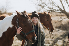 Smiling Woman With Horses