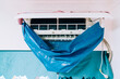 © Pansfun Images/Stocksy - Clean the air conditioner