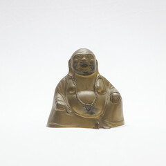 Sticker - Closeup of a statuette of Buddha isolated on a white background