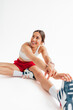 © Studio Firma/Stocksy - Sportswoman Exercising in Studio