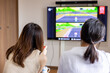© GOD ENTERTAINMENT - お家でテレビゲームを楽しむ女性