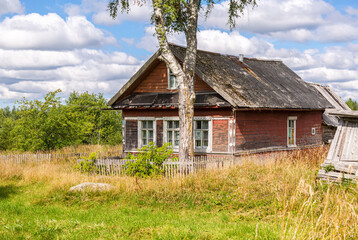 Wall Mural - Old rural wooden houses in abandoned russian village