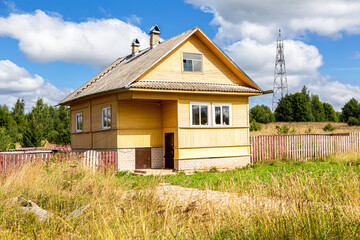 Wall Mural - Rural wooden house in russian village in summer day