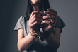 © S... - young woman's hands are tied